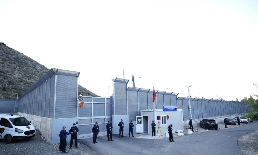 Migrants awaiting processing facility